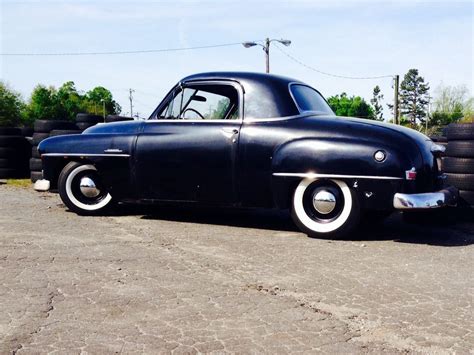 The pointed nose with smoothly integrated headlights was new that year, and the squared-off trunk makes it instantly recognizable from behind as a Chrysler product. . 51 plymouth business coupe for sale
